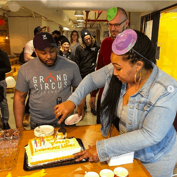 People cutting cake