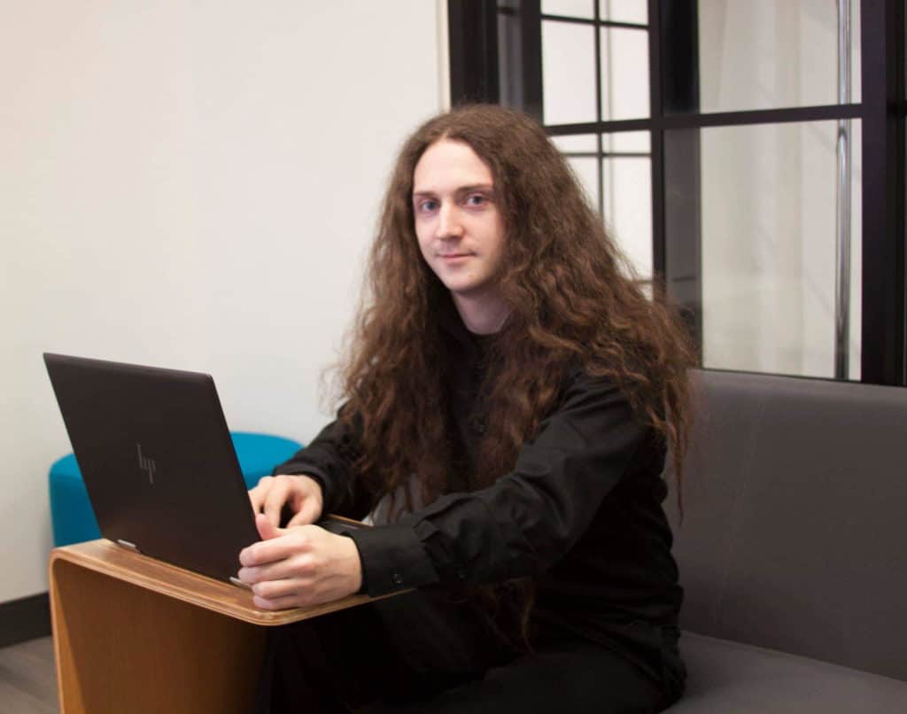 Roger working on his laptop