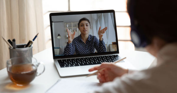 Women gesturing during online video meeting