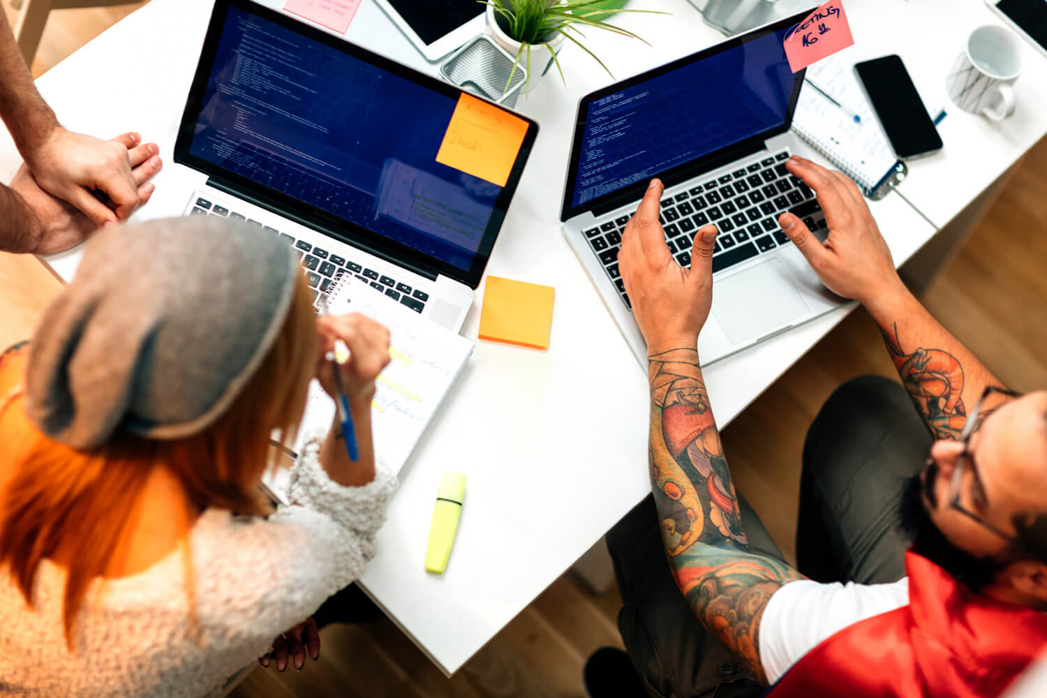Two-workers-coding-on-laptops